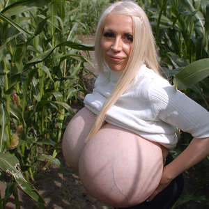 Beshine is standing in the middle of a growing cornfield