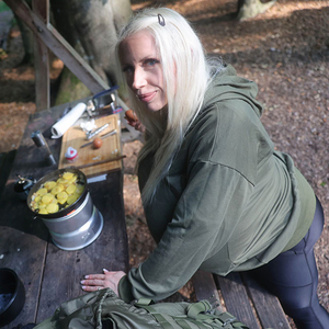 Beshine prepares a delicious dish in the forest