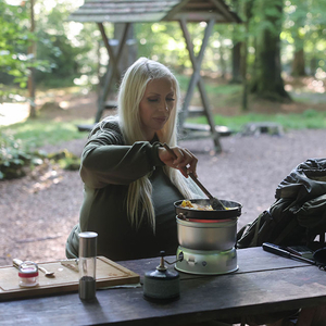 Beshine prepares a delicious dish in the forest