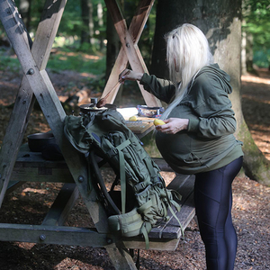 Beshine prepares a delicious dish in the forest