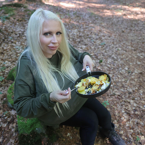 Beshine prepares a delicious dish in the forest