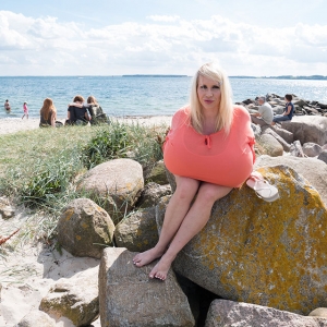 Enormous titted blonde at a beach