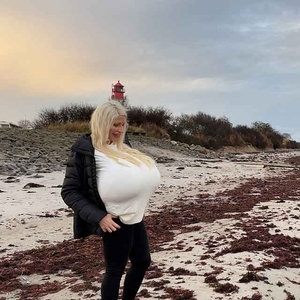 Winter beach walk with the biggest enhanced breasts in the world