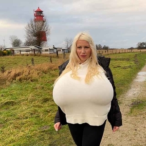 Winter beach walk with the biggest enhanced breasts in the world