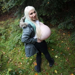 Autumn season and biggest boobed blonde Beshine walks through the forests