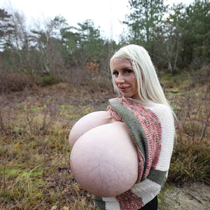 Worlds biggest breasted woman Beshine is stretching her cozy sweater