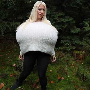 The biggest breasts in the world stretch a wool sweater